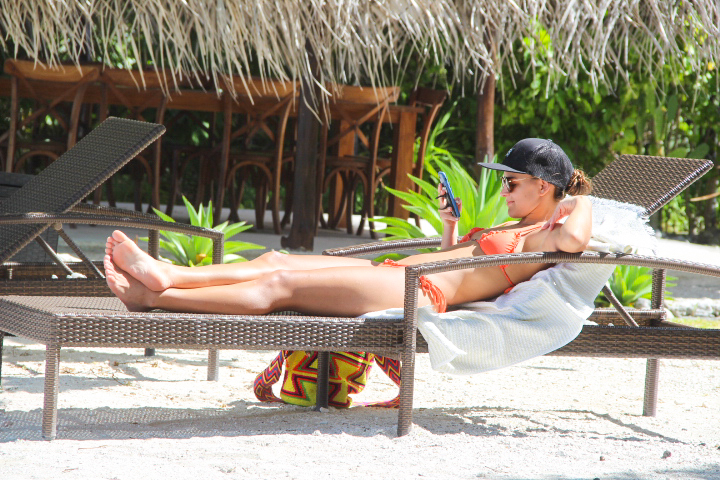 Bella relaxing in Le Coconut Lodge's private beach