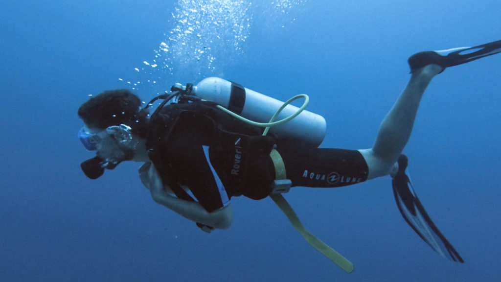 Pedro swimming in scuba dive gear