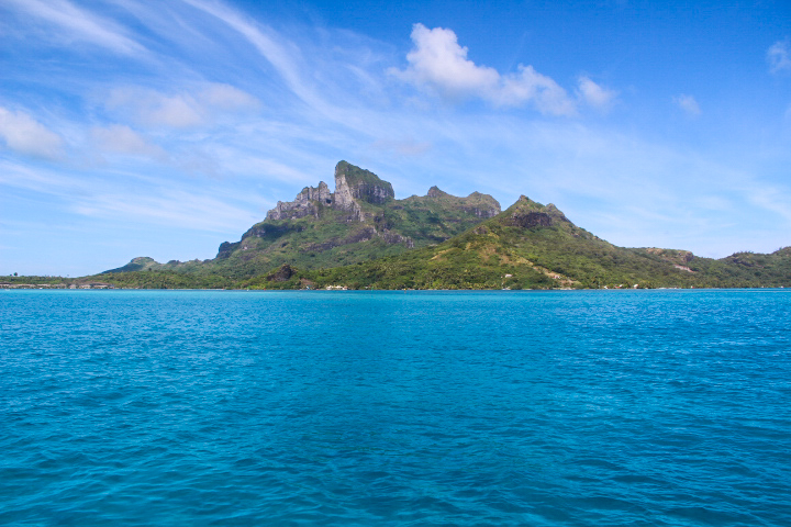 Spectacular view of Bora Bora, blue waters and shiny skies.