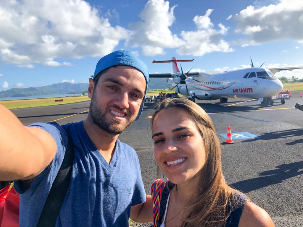 Pedro and Bella in Raiatea's airport. Plane at the back.