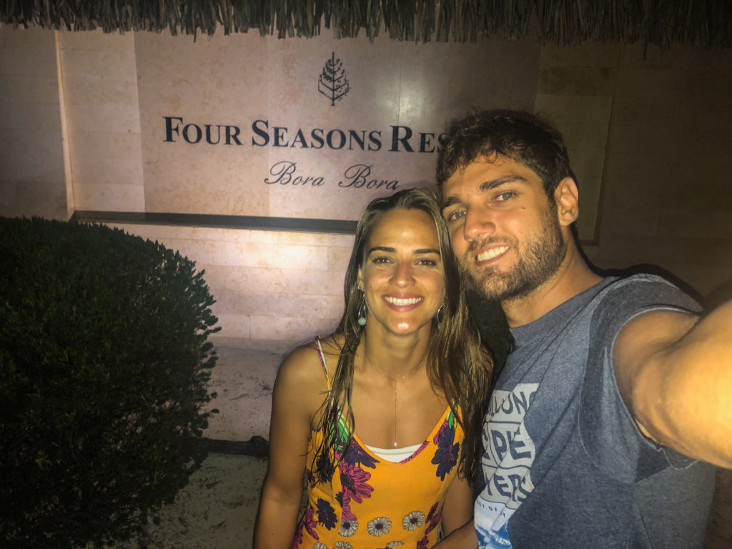 Pedro and Bella in front of the Bora Bora Four Seasons resort's plate