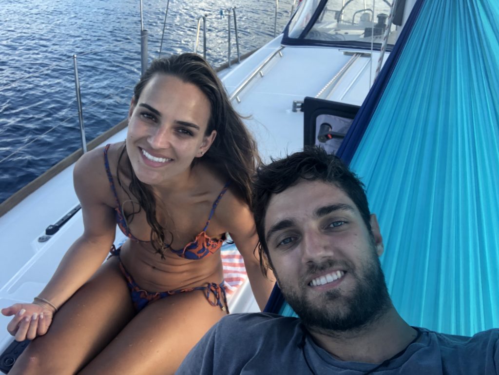 Pedro and Bella at the bow of the boat taking a selfie.